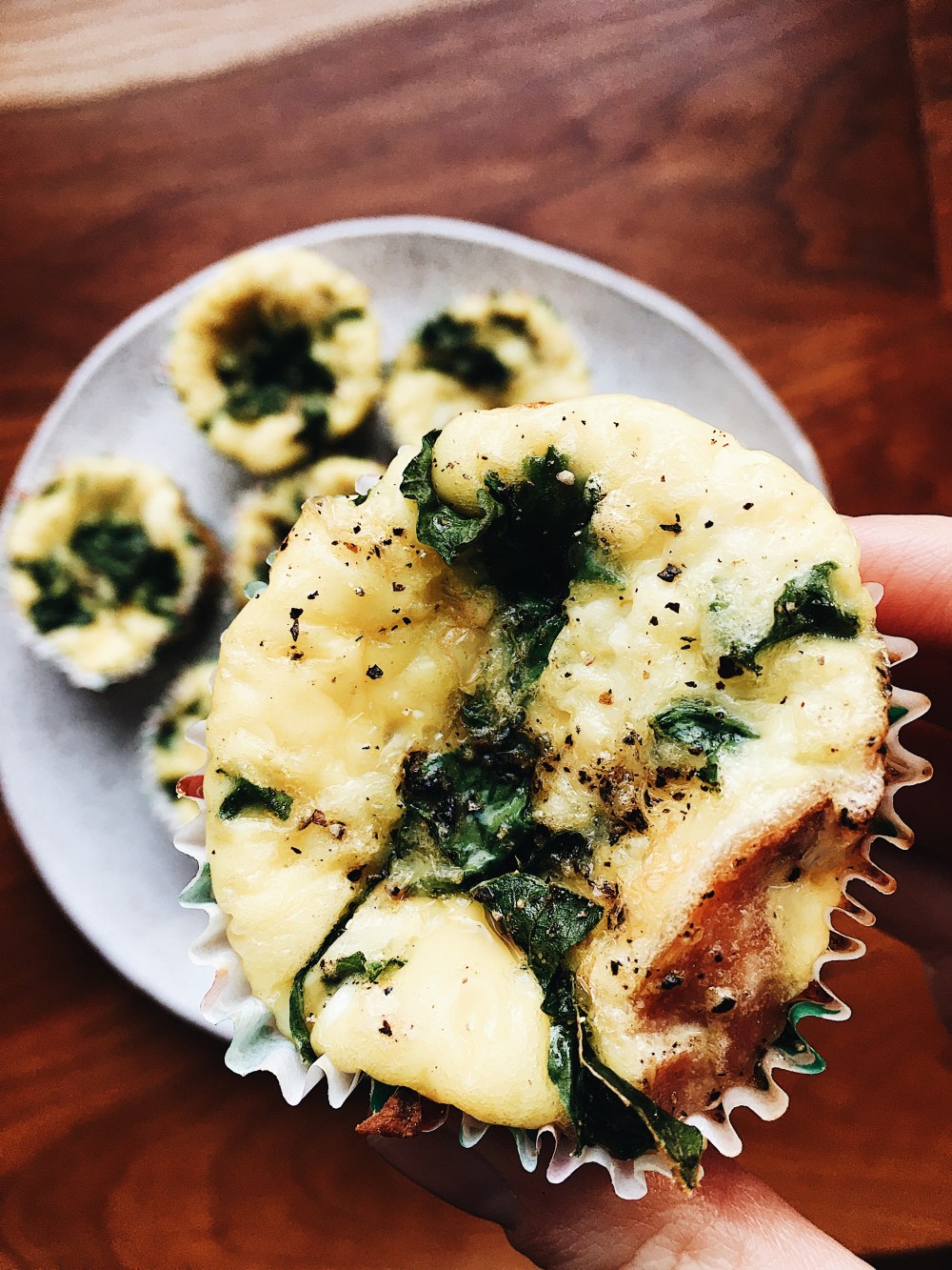 Egg Muffin Up Close Holding Over Plate.jpg
